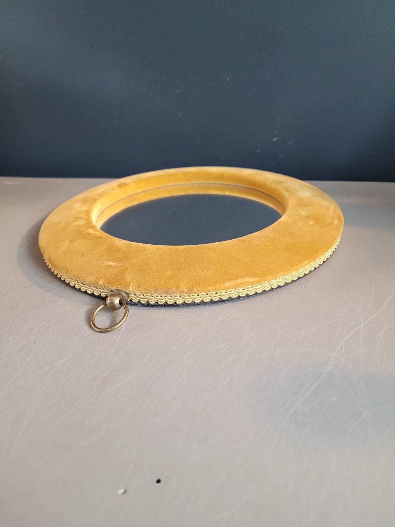 Vintage mirror with mustard velvet frame