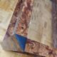Table basse vintage en loupe d'orme et verre