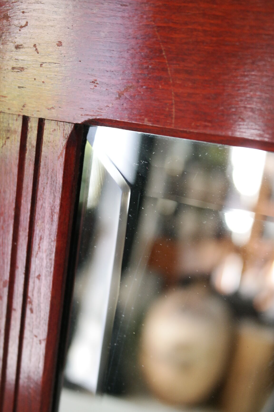 Red wooden wall-mounted coat rack and Art Deco mirror
