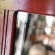 Red wooden wall-mounted coat rack and Art Deco mirror