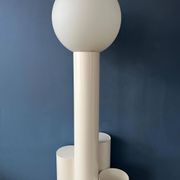 White floor lamp "Close Encounter" and plant stand by Kerst Koopman