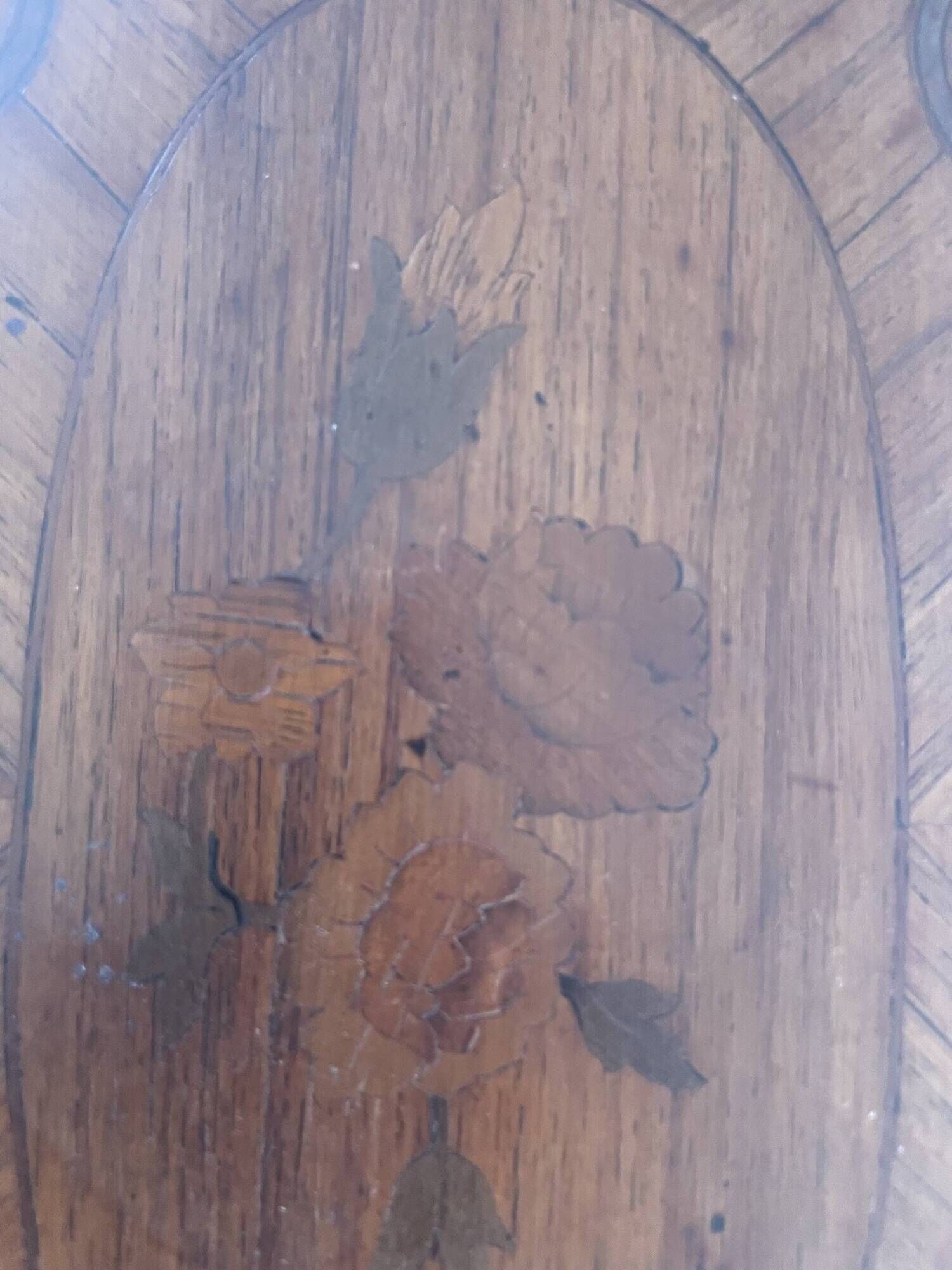 Oval bedside table from the Transition period in marquetry and bronze.