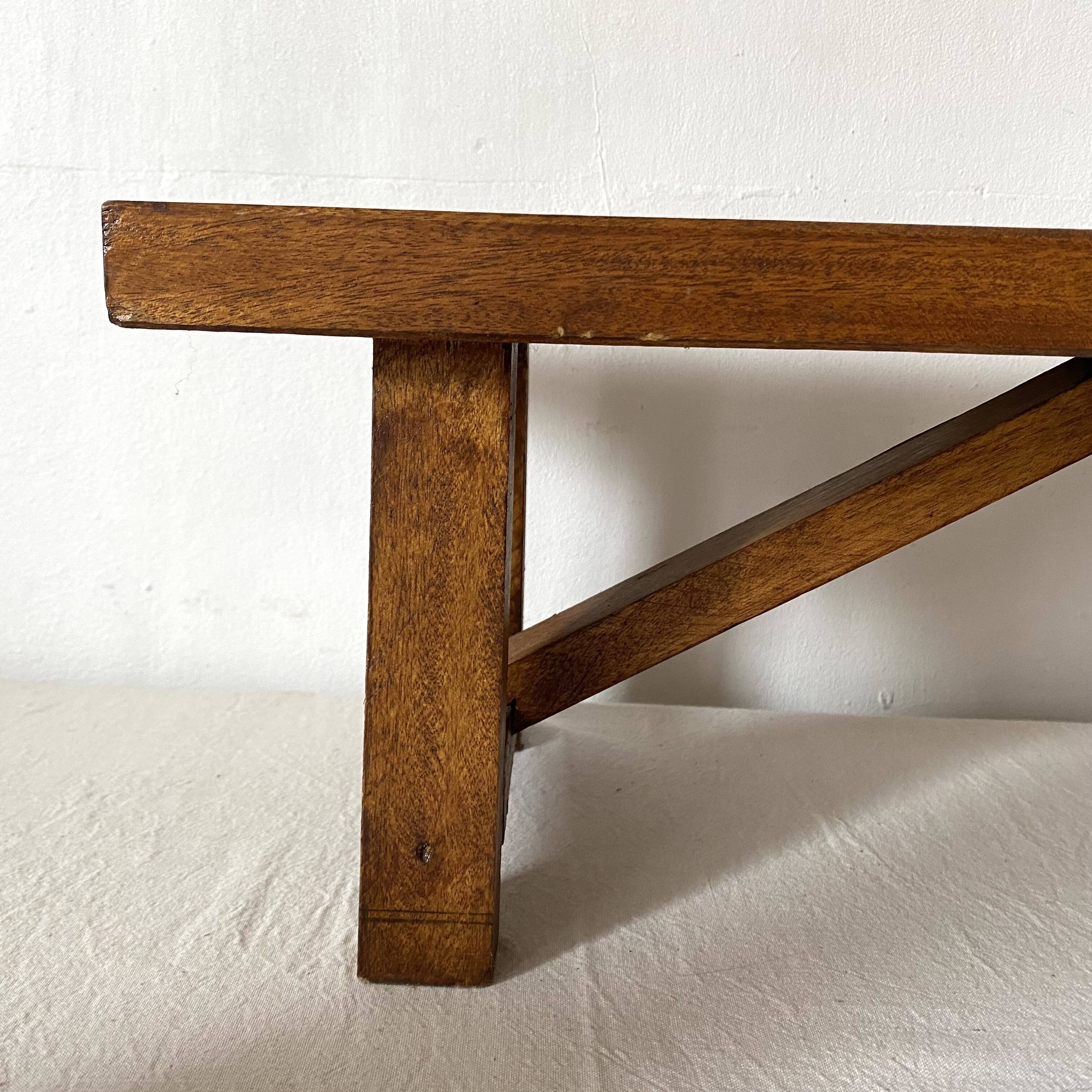 Low stool in varnished wood