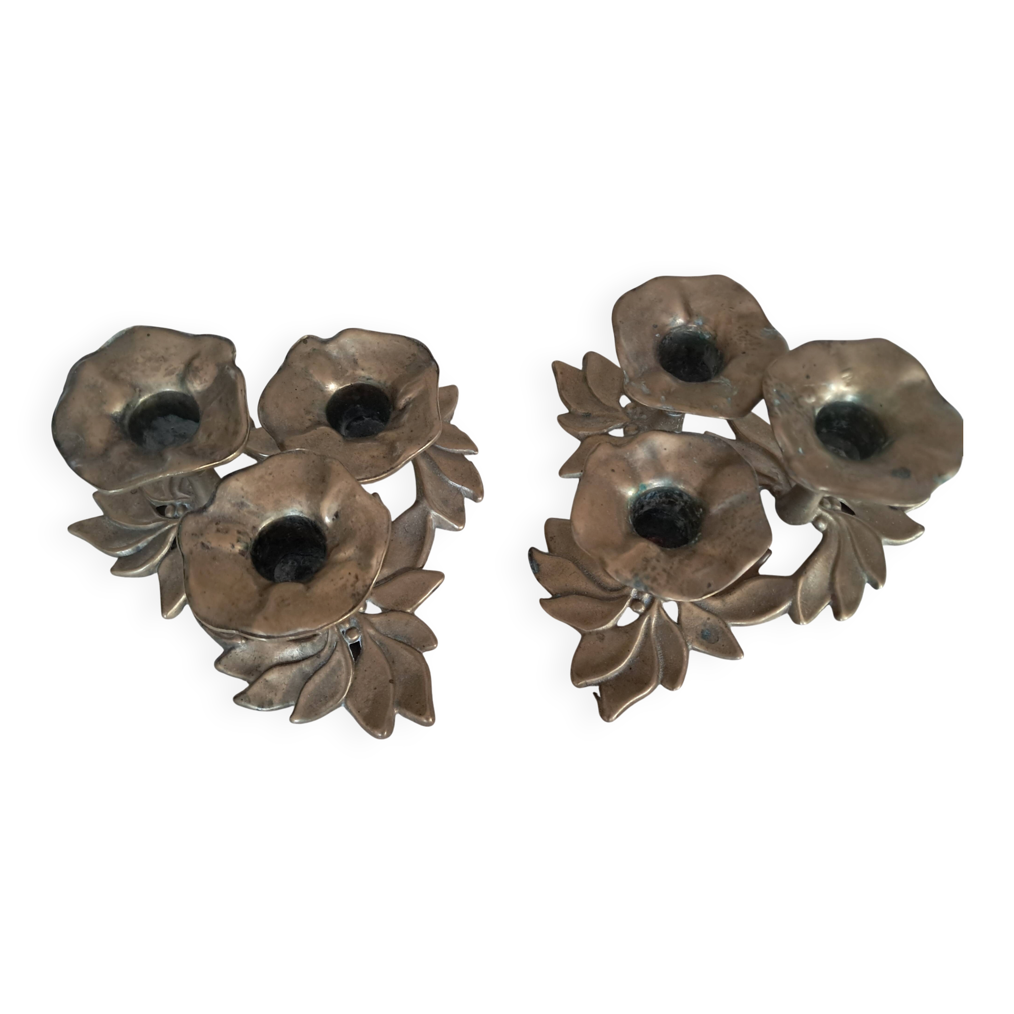 Pair of antique three-branch candlesticks with a floral design.