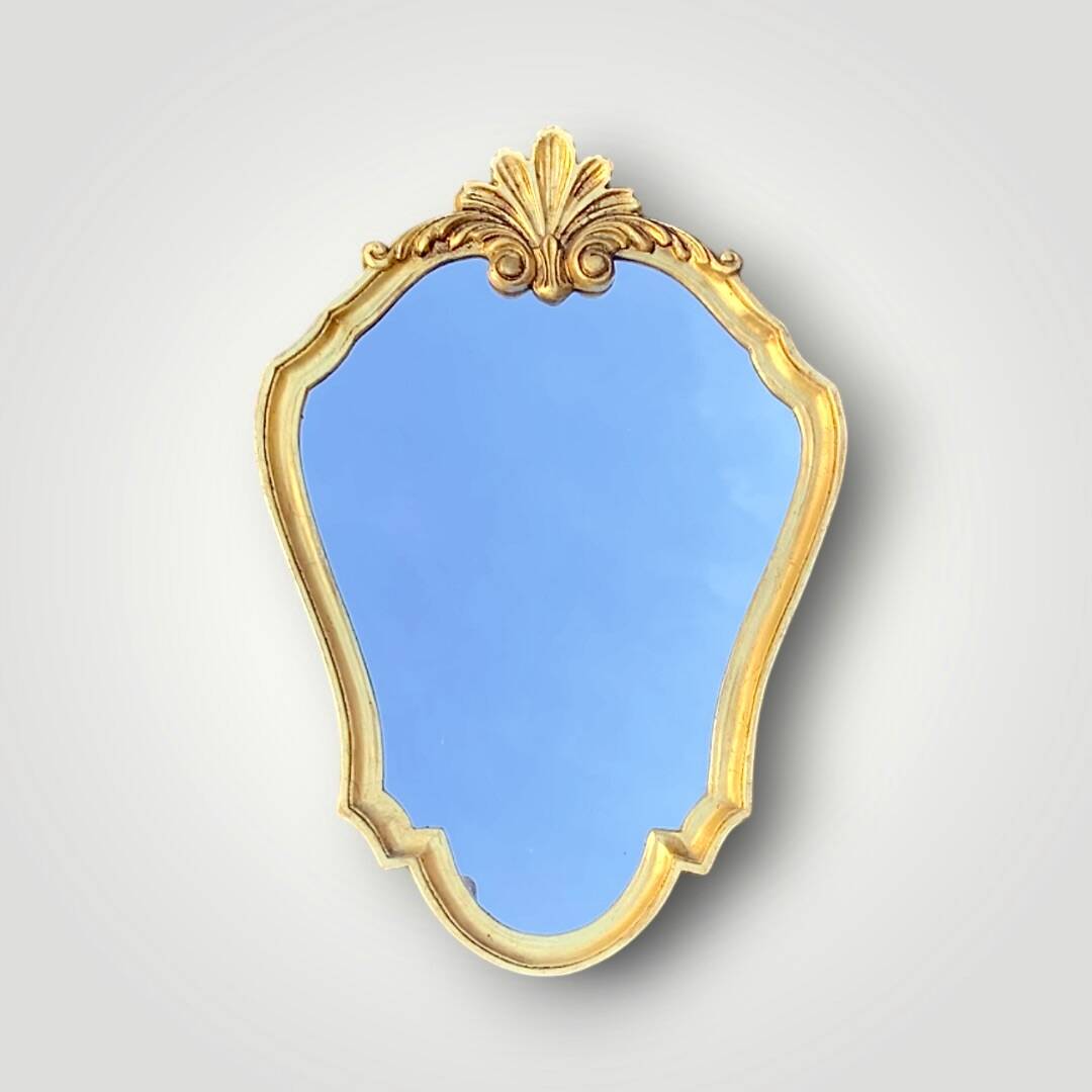 Vintage wall mirror with golden resin shell