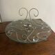 Beautiful cheese platter in glass and stainless steel with arabesques.