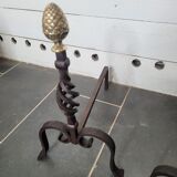 Old pair of wrought iron pegs with brass pine cone