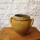 Old yellow glazed terracotta pot
