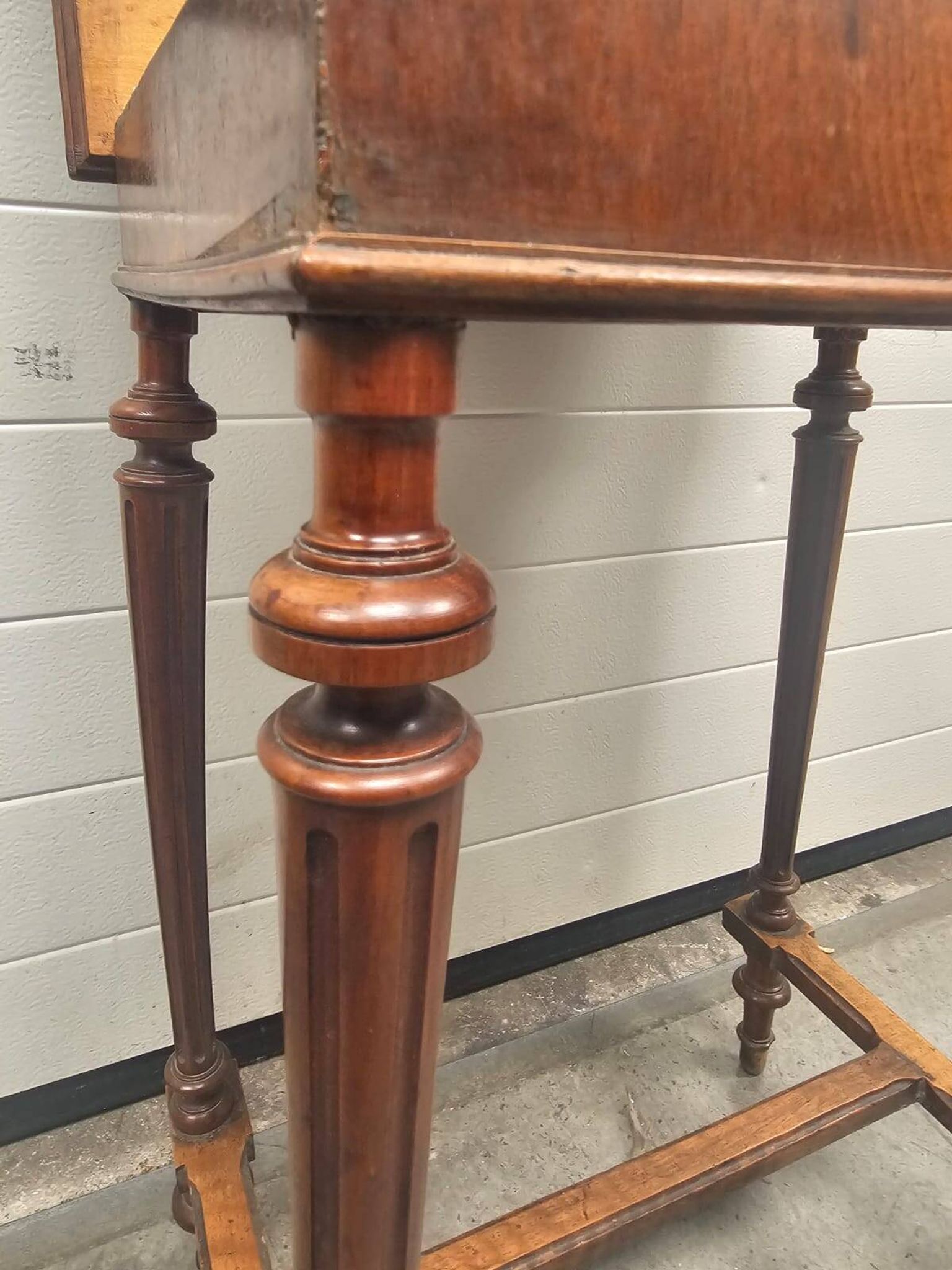 Antique dressing table with floral marquetry and integrated mirror.
