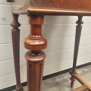 Antique dressing table with floral marquetry and integrated mirror.