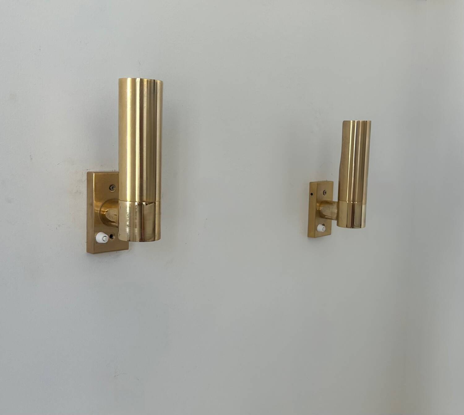 Pair of vintage adjustable brass wall lights, France 1970.