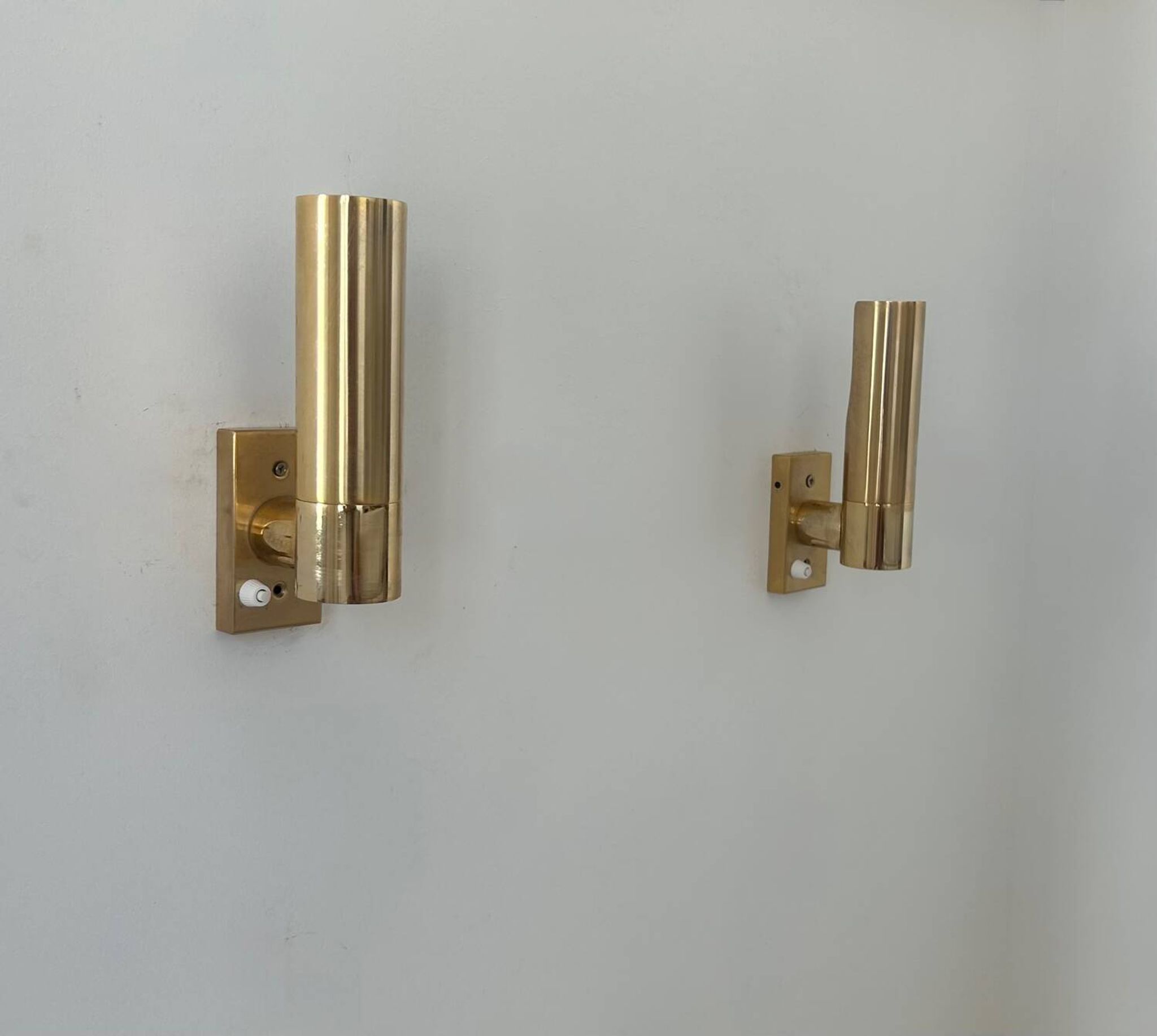 Pair of vintage adjustable brass wall lights, France 1970.