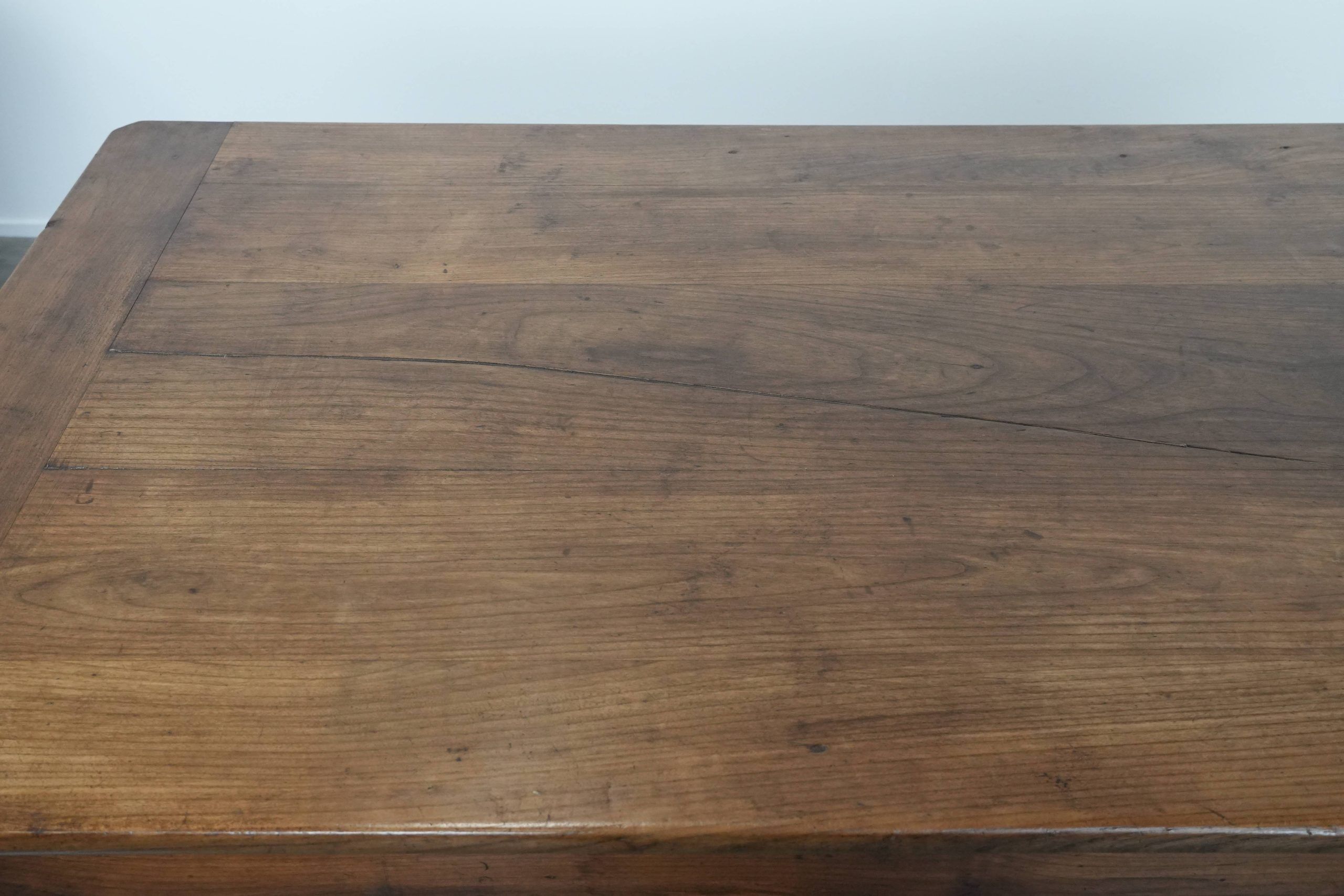 Antique French farmhouse dining table with two drawers and a pull-out board