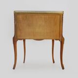 Baroque style wooden chest of drawers with bronze frieze.