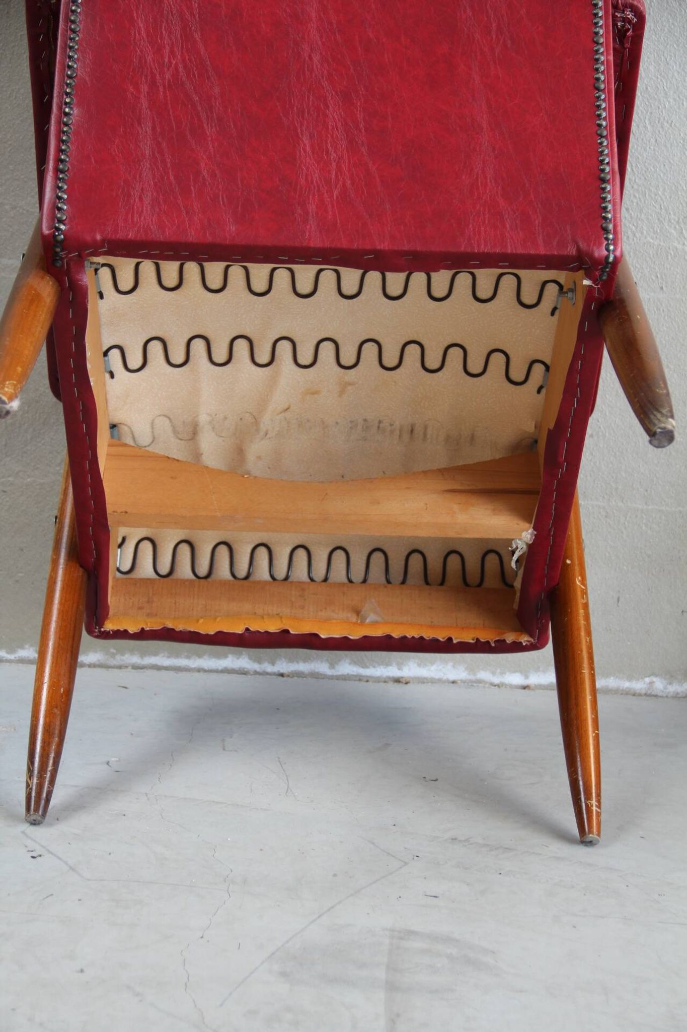 Vintage armchair in red leatherette