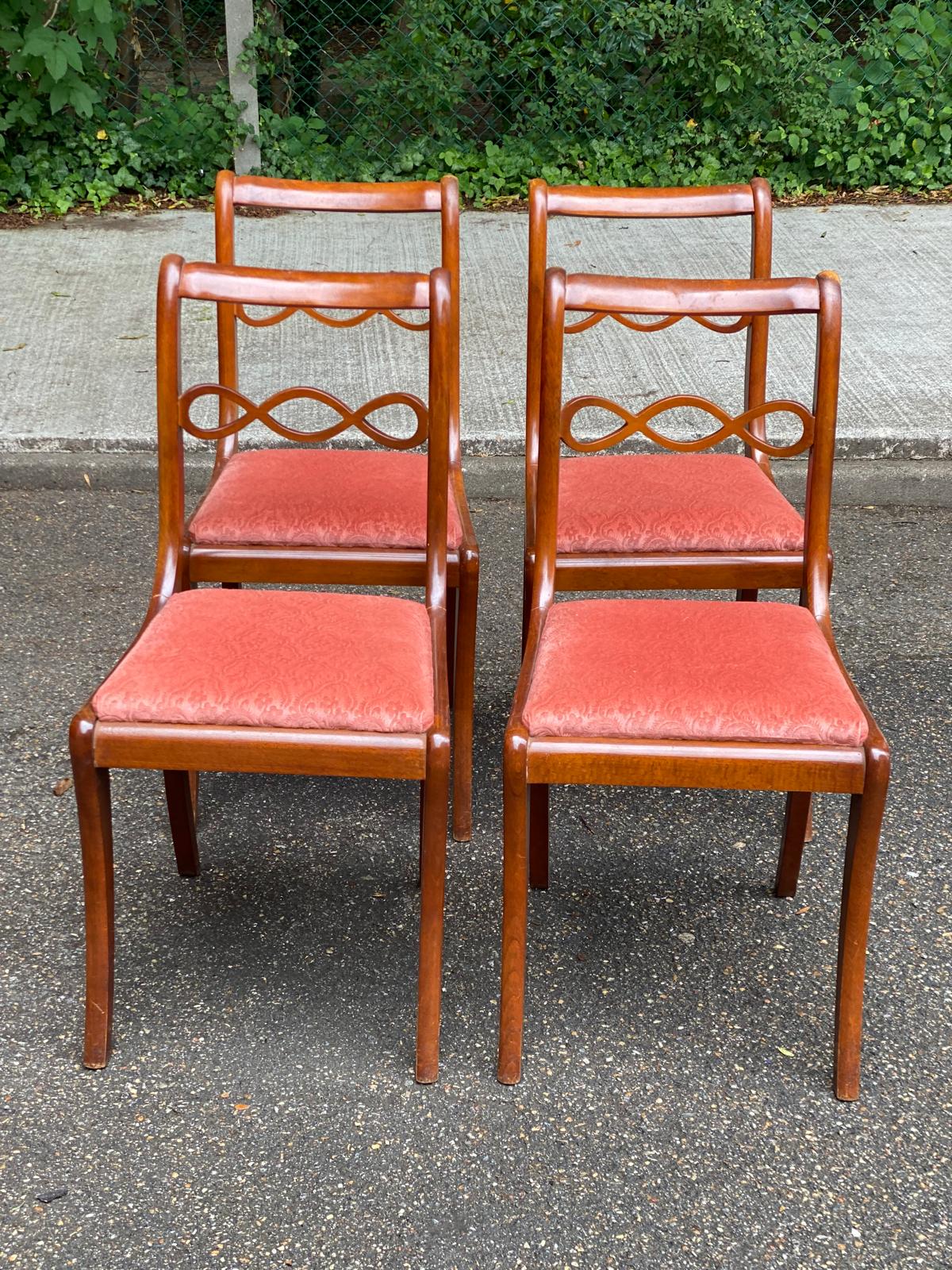 4 dining chairs made of solid wood and pink velvet fabric from the 1950s.