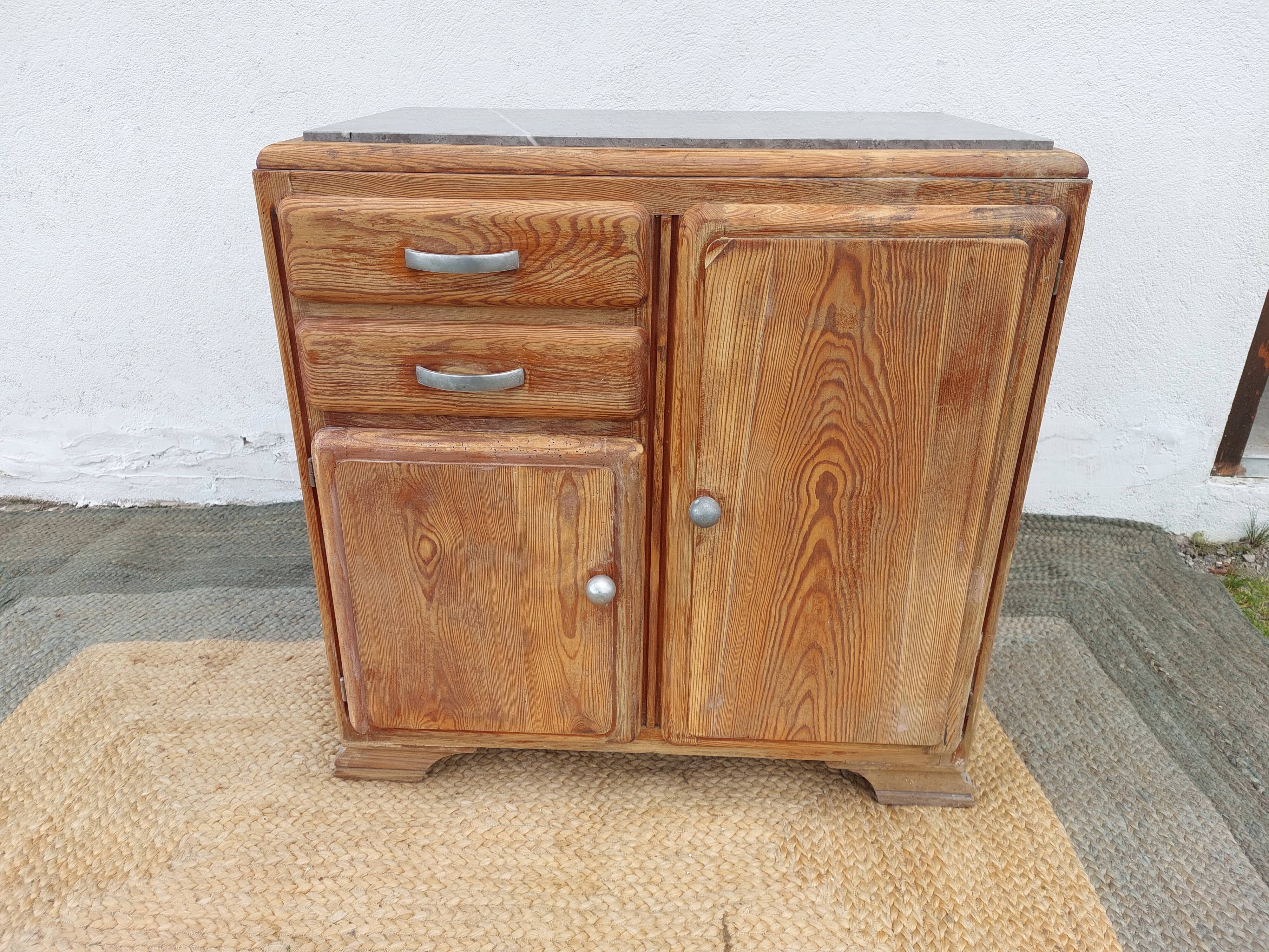 Vintage wooden buffet with a marble top.