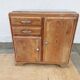 Vintage wooden buffet with a marble top.