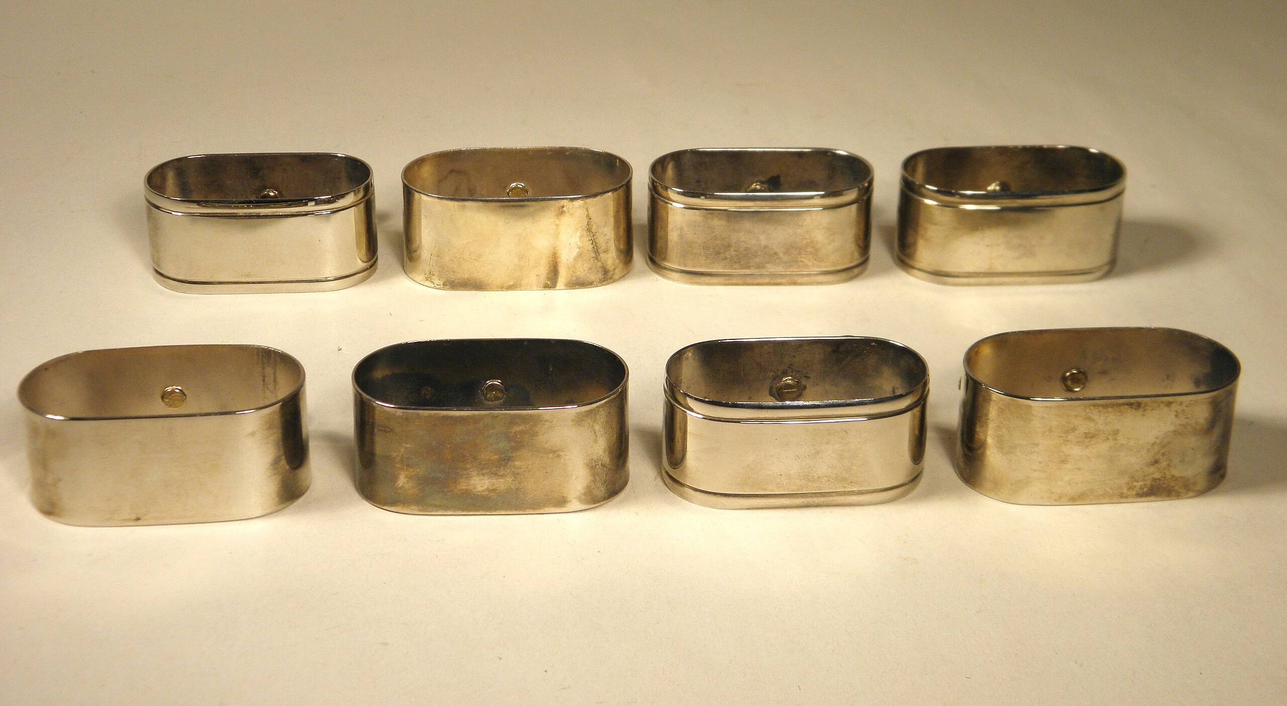 8 silver and gold napkin rings