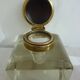 Old and imposing thick glass desk inkwell, gold brass lid