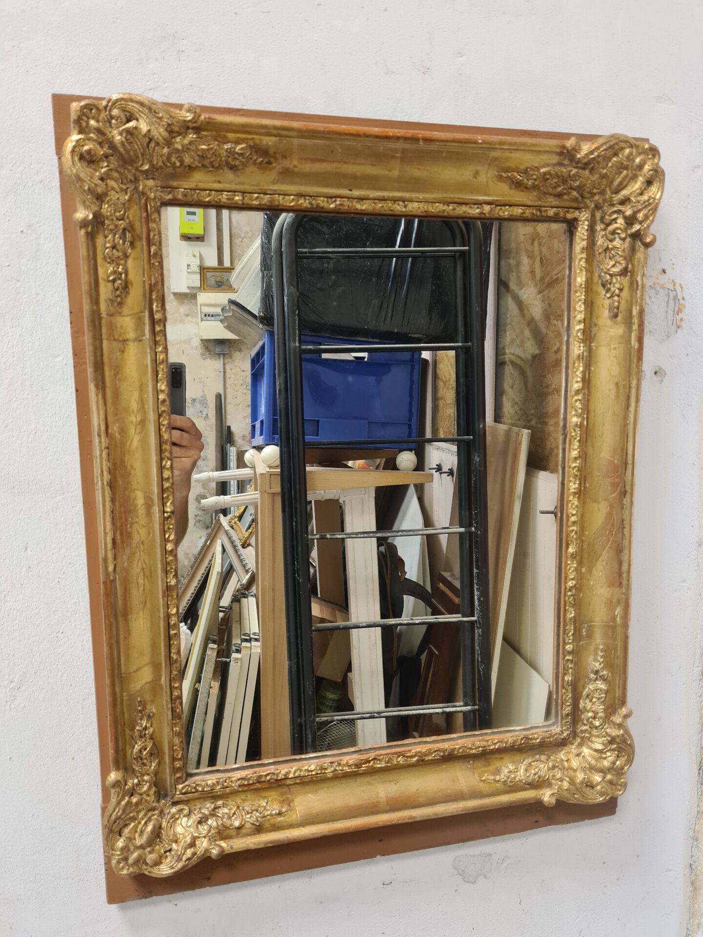 Antique gilded mirror, 19th century Empire style.