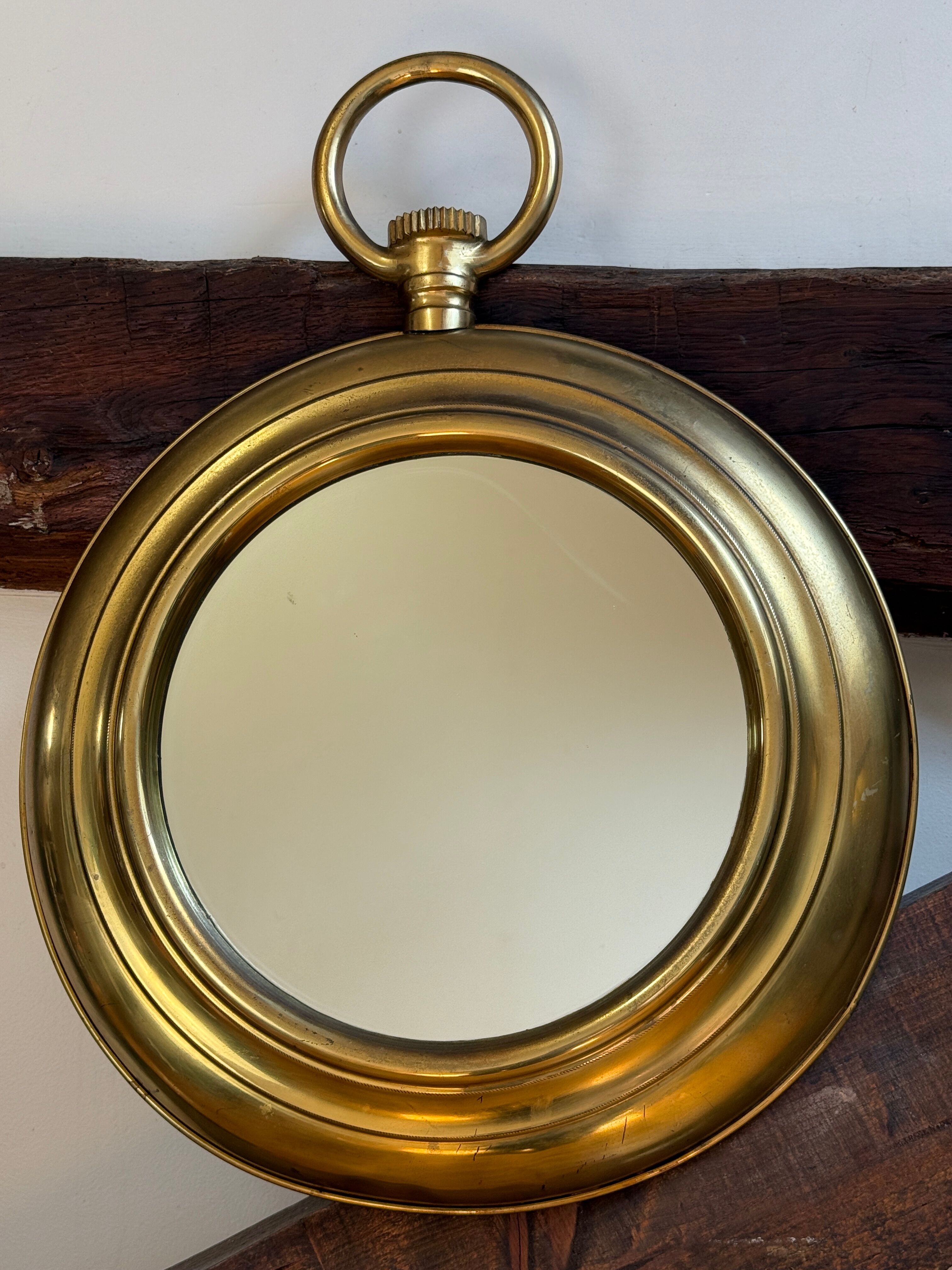 Large brass mirror in the style of Piero Fornasetti, 60 Italy.