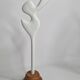 Biomorphic bisque sculpture, on turned wooden base, 37 cm