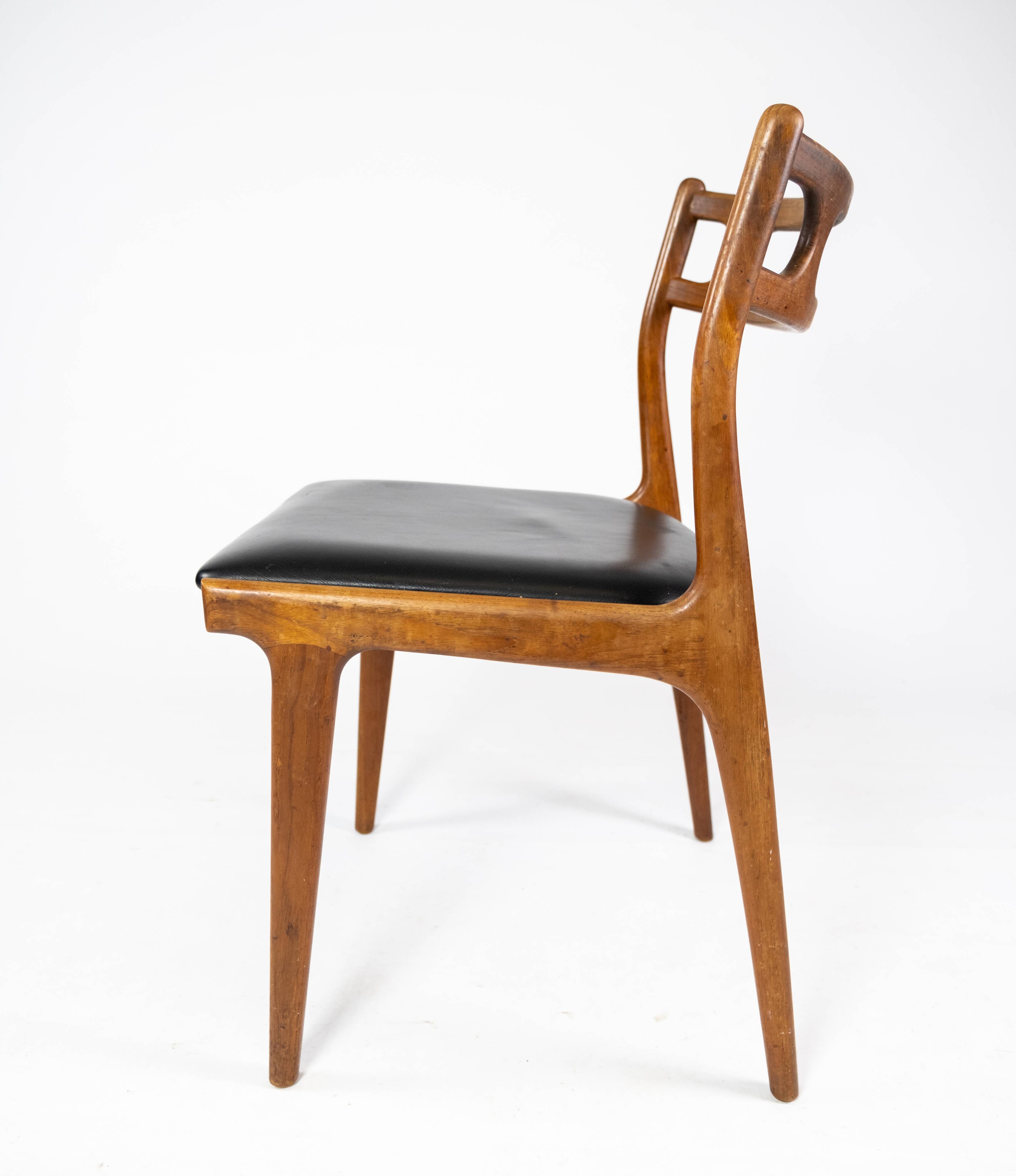 A set of four dining room chairs of teak of danish design, 1960s