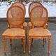 4 caned Louis XVI medallion dining chairs from the 19th century.