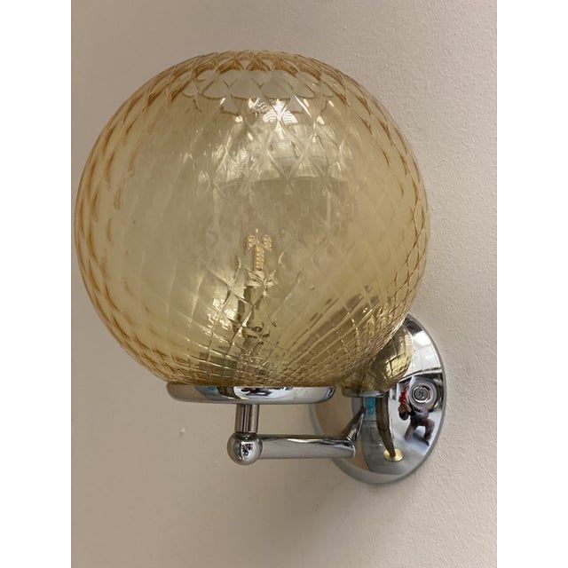 Contemporary "ballotton" amber murano glass wall sconce