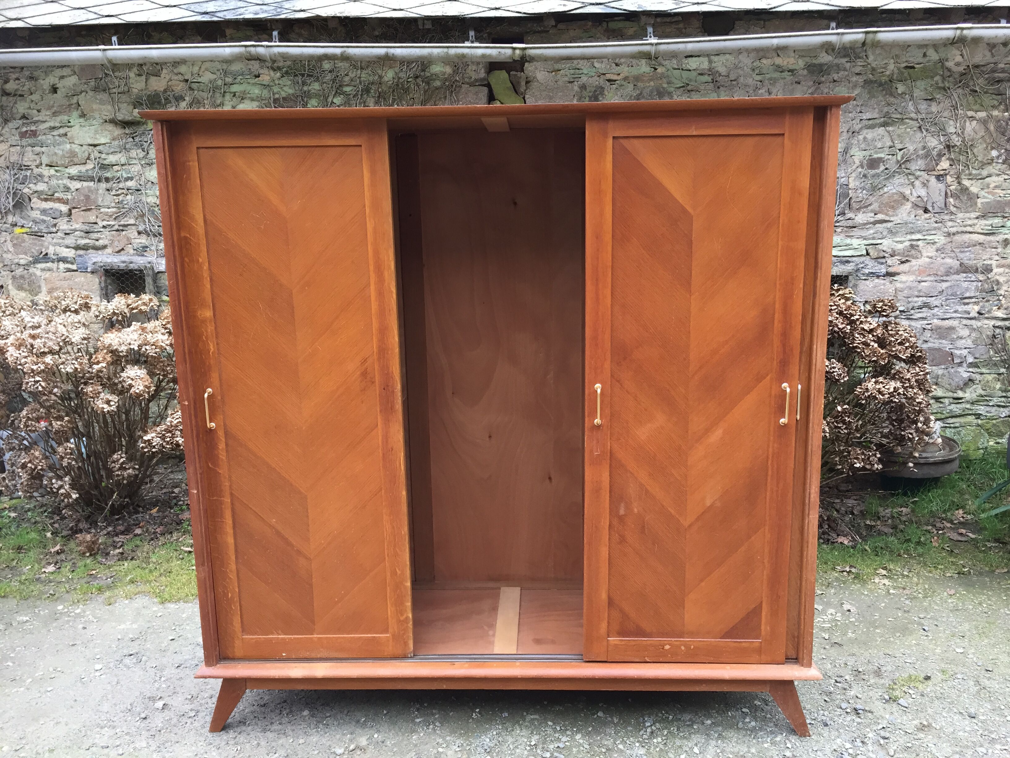 Vintage wardrobe compass feet with 3 sliding oak doors.