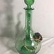 Old refreshing carafe pourer in green blown glass with vintage cap