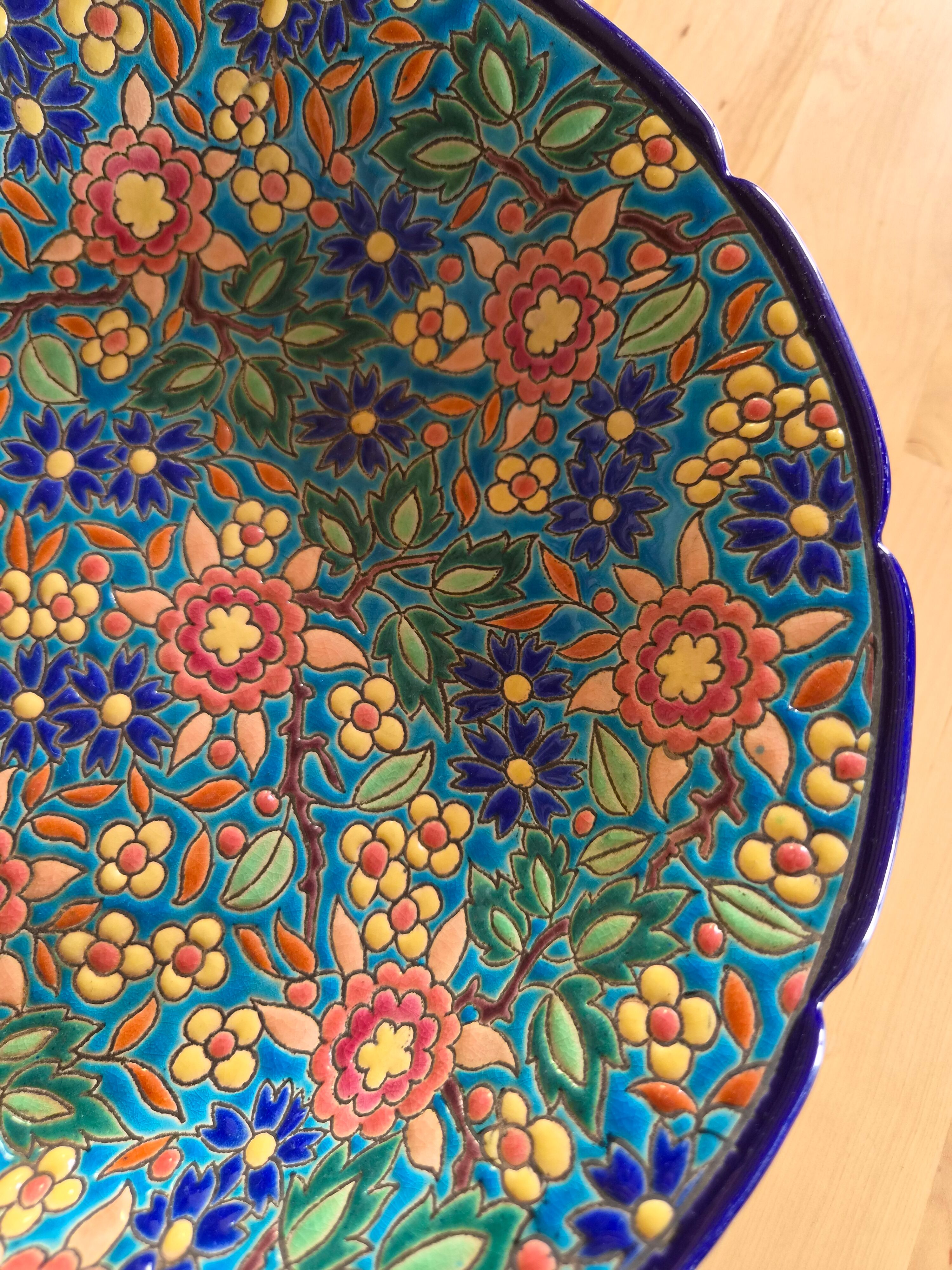 Plate in Émaux de Longwy with no cracks or chips.