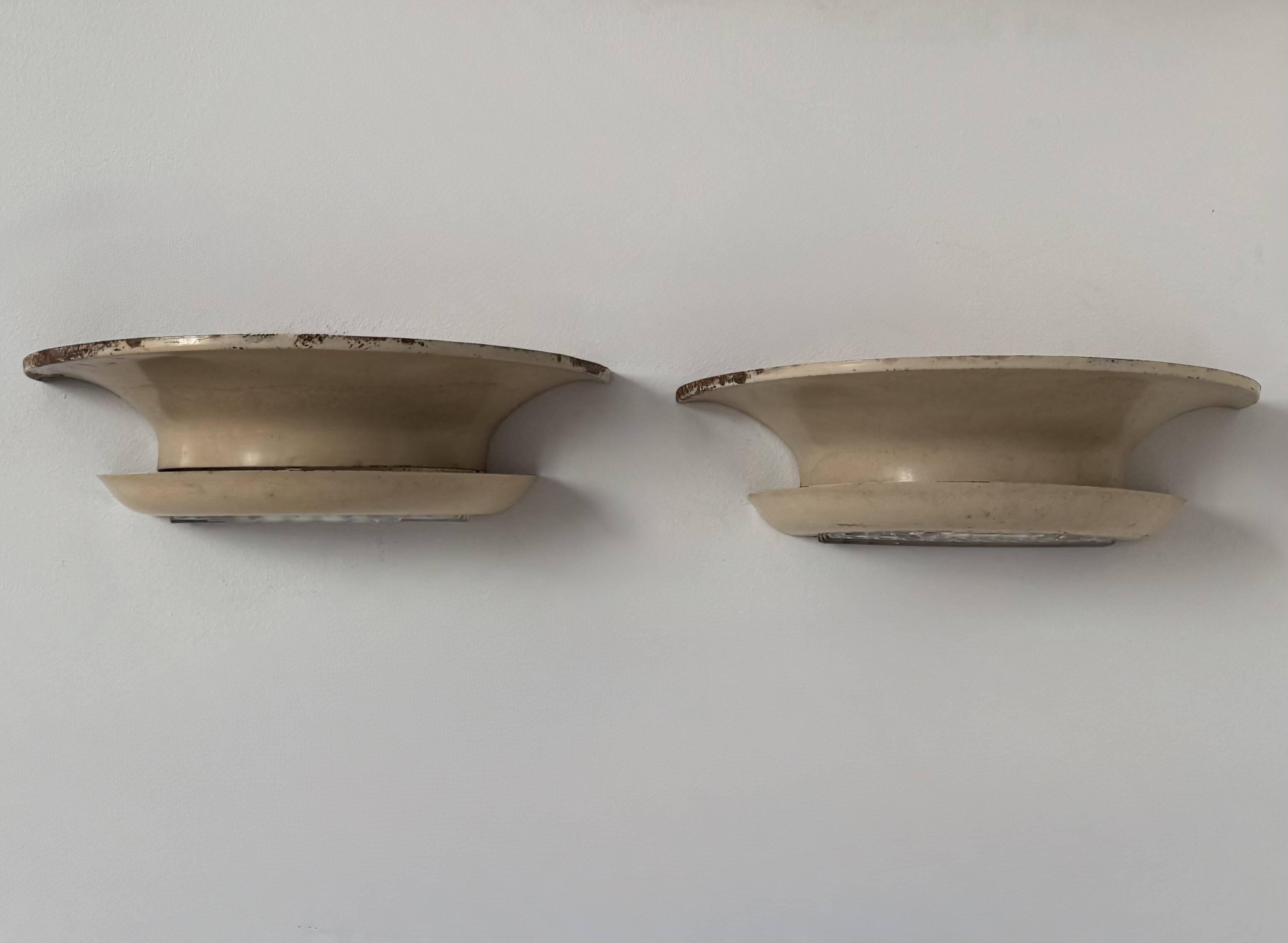 Pair of vintage modernist wall lights, beige painted metal and glass, France, 1930