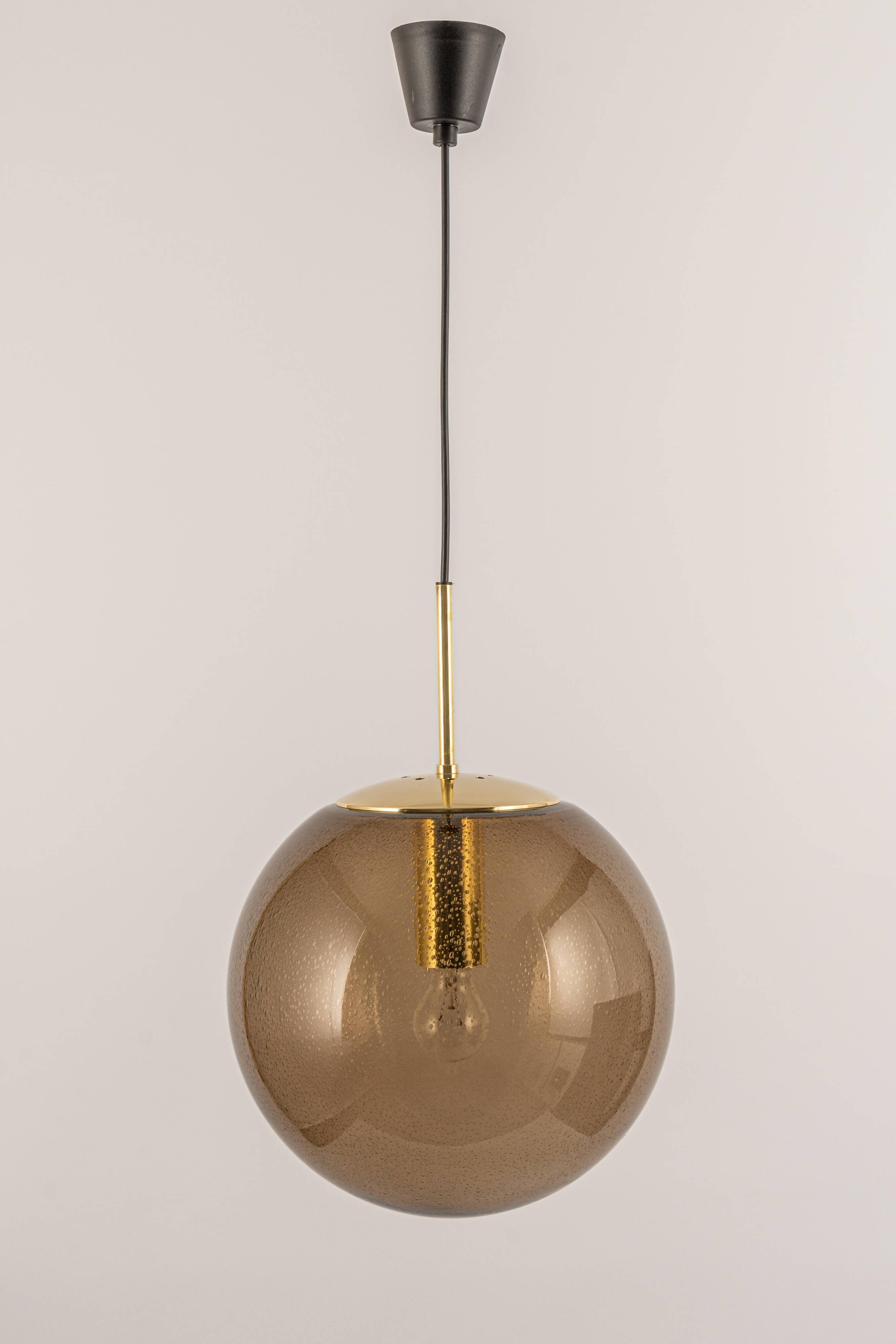 Large smoked glass ball pendant by Limburg with brass, Germany, 1970s.