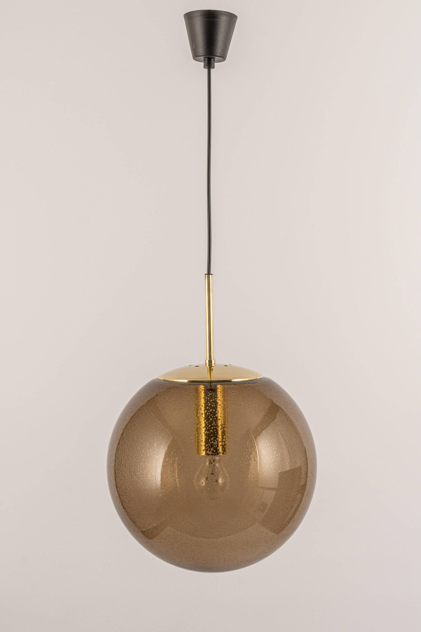 Large smoked glass ball pendant by Limburg with brass, Germany, 1970s.