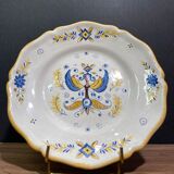 Earthenware plate decorated with winged character decoration in Nevers style, Auxerrois