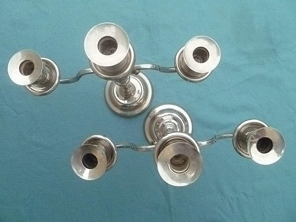 Pair of silver-colored metal candlesticks