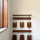 Vintage teak wall coat rack