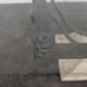 1980s coffee table with a travertine style and glass top.
