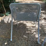 Perforated metal armchairs