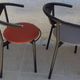 4 Gondola-style chairs with a sturdy metal frame and faux leather for