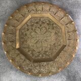 Oriental brass tray with chiseled decoration of arabesques and flowers