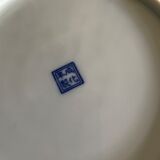 Asian porcelain plates decorated with blue dragons