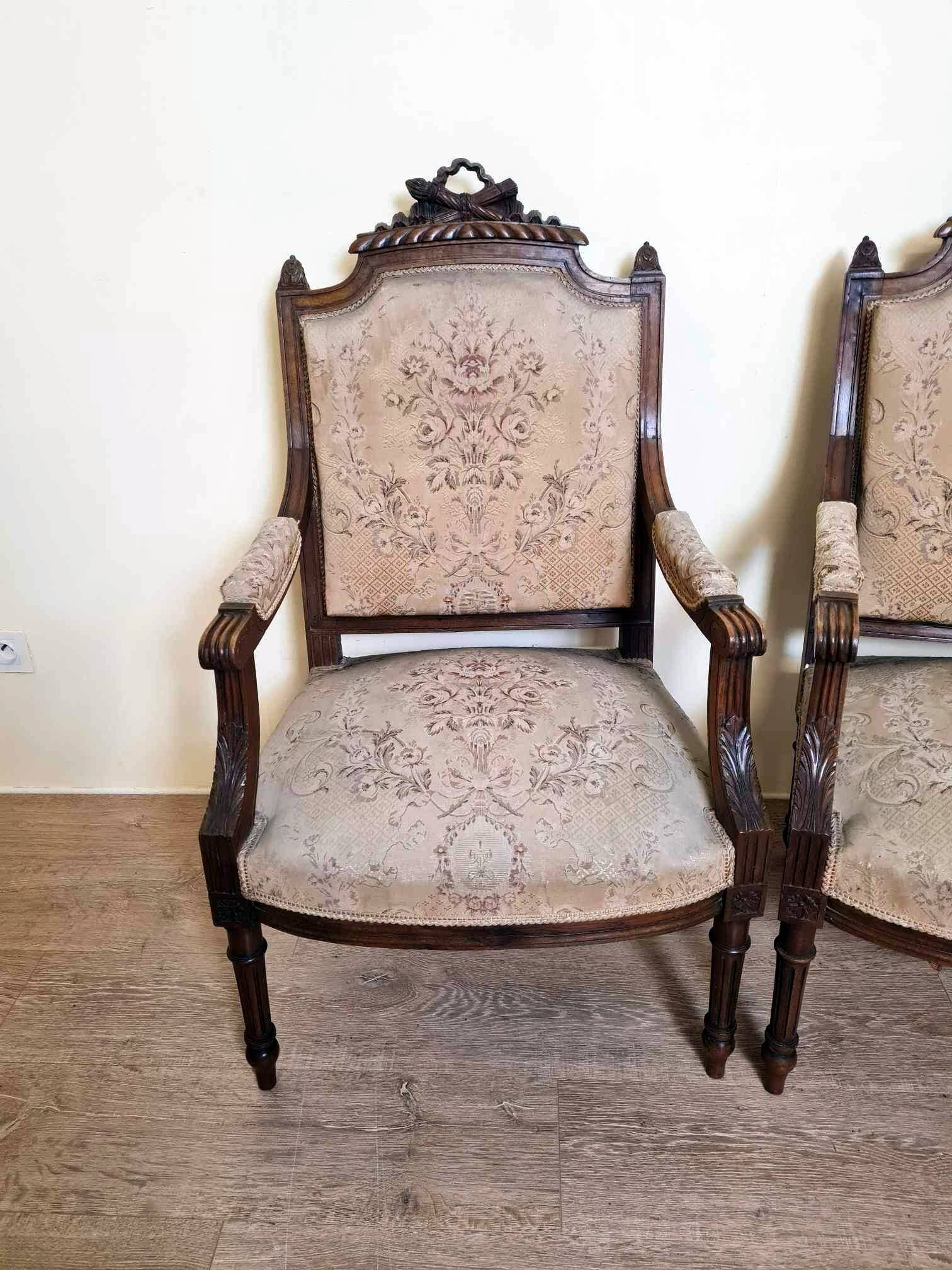 Pair of Louis XVI style queen-style armchairs in richly carved wood