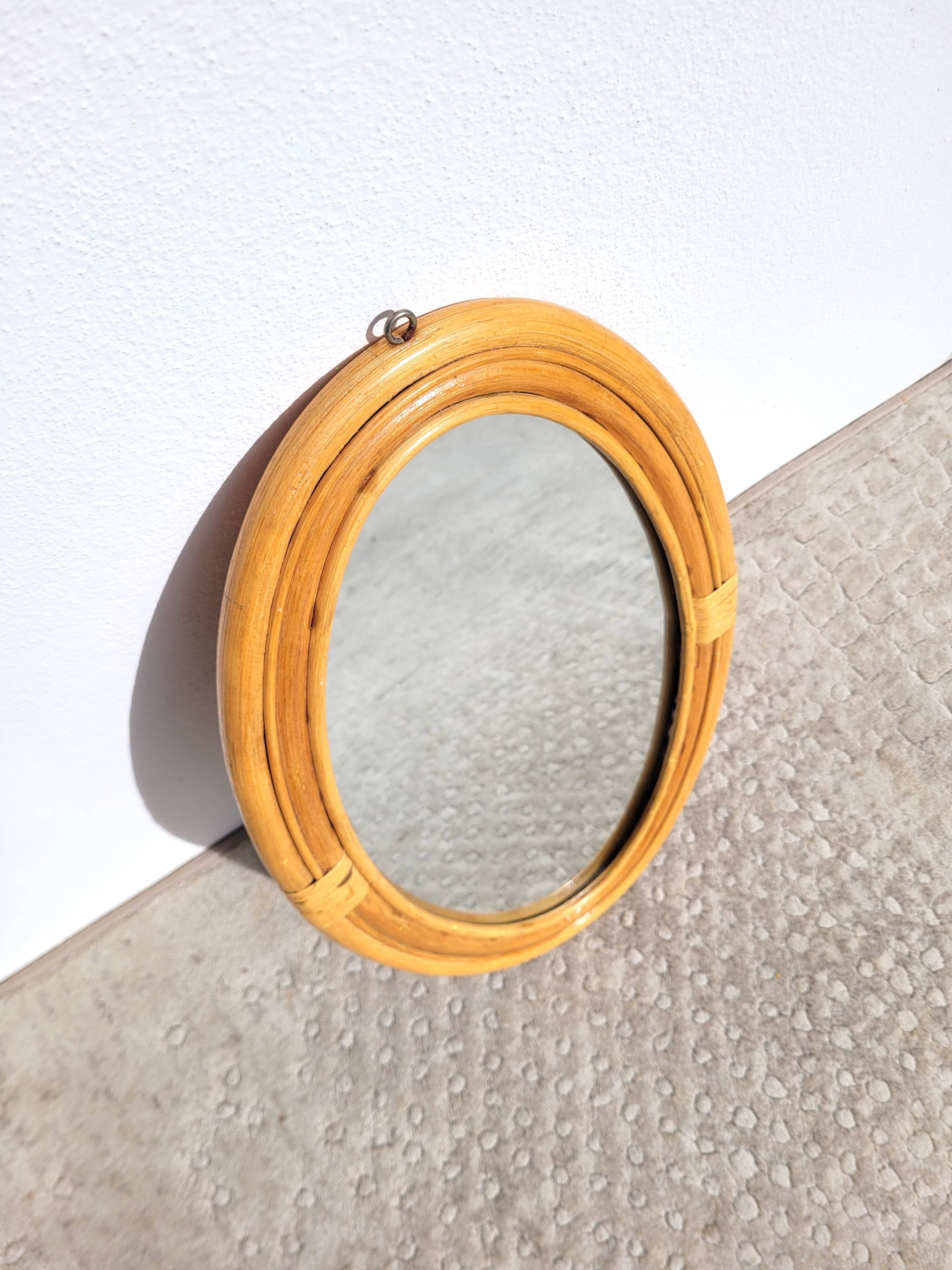 Oval rattan portrait mirror