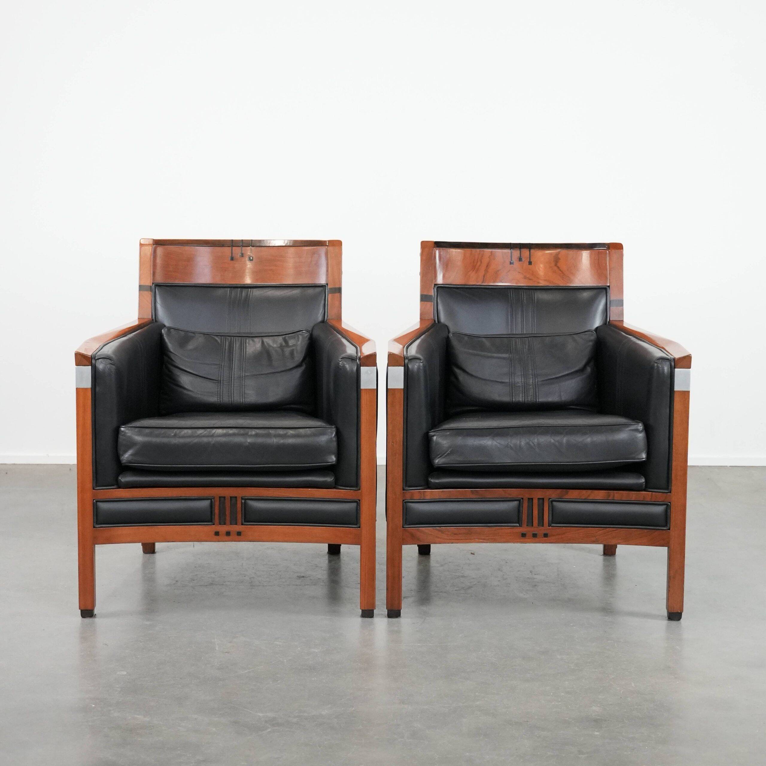 Set of  two black leather Art Deco design armchairs