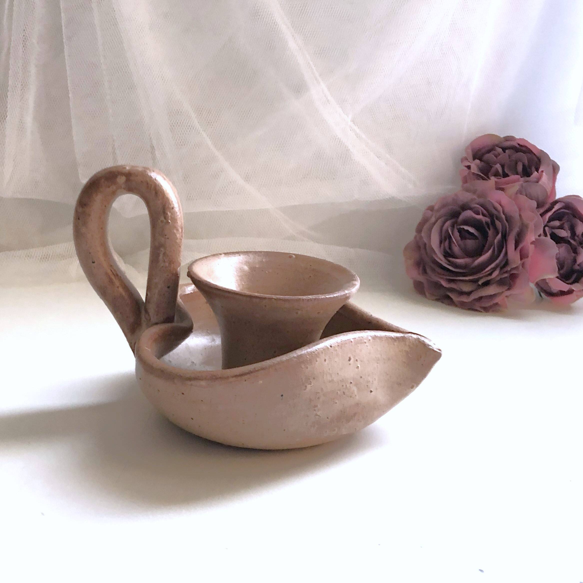 Glazed stoneware heart-shaped hand candle holder