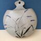 Ceramic wall plant holder with floral motifs, unknown signature