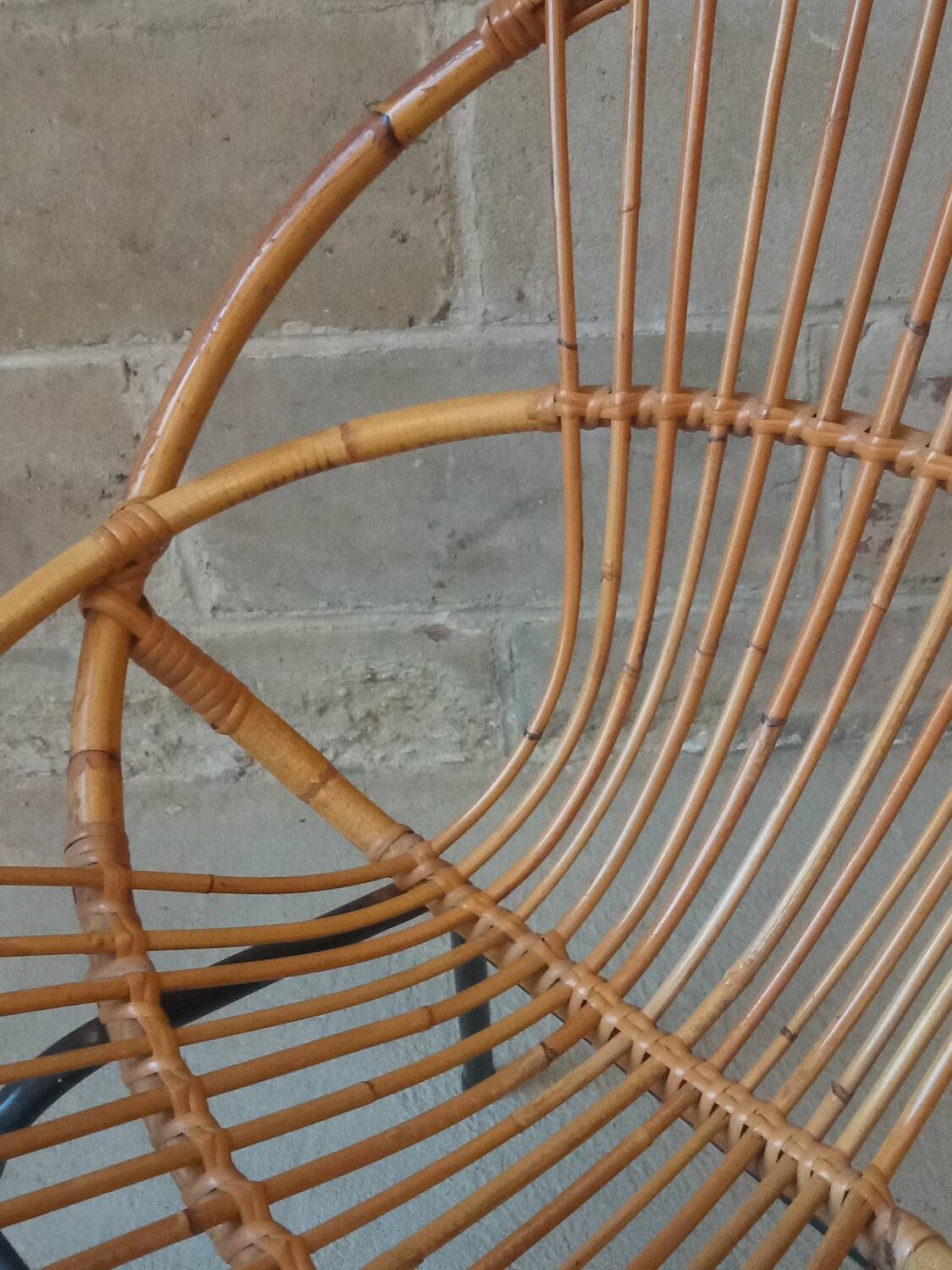 Rattan armchair with metal base from the 1950s